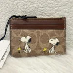 NWT COACH x Peanuts Mini Skinny ID Case – Signature Canvas with Snoopy Print CBT14