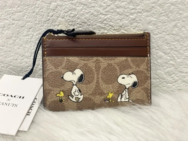 NWT COACH x Peanuts Mini Skinny ID Case CBT14 in Signature Canvas with Snoopy Print