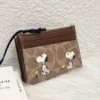 NWT COACH x Peanuts Mini Skinny ID Case CBT14 in Signature Canvas with Snoopy Print