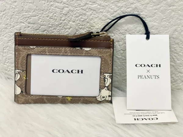 NWT COACH x Peanuts Mini Skinny ID Case CBT14 in Signature Canvas with Snoopy Print