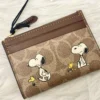 NWT COACH x Peanuts Mini Skinny ID Case CBT14 in Signature Canvas with Snoopy Print