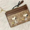 NWT COACH x Peanuts Mini Skinny ID Case CBT14 in Signature Canvas with Snoopy Print