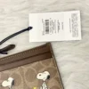 NWT COACH x Peanuts Mini Skinny ID Case CBT14 in Signature Canvas with Snoopy Print