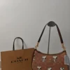 COACH x Peanuts Teri Shoulder Bag CBJ88 in Tan Brown Signature Canvas with Snoopy Print COACH x Peanuts Teri Shoulder Bag CBJ88 in Tan Brown Signature Canvas with Snoopy Print