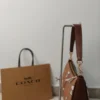 COACH x Peanuts Teri Shoulder Bag CBJ88 in Tan Brown Signature Canvas with Snoopy Print COACH x Peanuts Teri Shoulder Bag CBJ88 in Tan Brown Signature Canvas with Snoopy Print