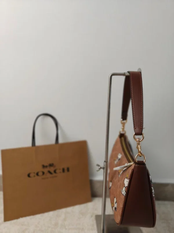 COACH x Peanuts Teri Shoulder Bag CBJ88 in Tan Brown Signature Canvas with Snoopy Print COACH x Peanuts Teri Shoulder Bag CBJ88 in Tan Brown Signature Canvas with Snoopy Print