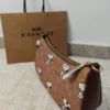 COACH x Peanuts Teri Shoulder Bag CBJ88 in Tan Brown Signature Canvas with Snoopy Print COACH x Peanuts Teri Shoulder Bag CBJ88 in Tan Brown Signature Canvas with Snoopy Print