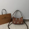 COACH x Peanuts Teri Shoulder Bag CBJ88 in Tan Brown Signature Canvas with Snoopy Print COACH x Peanuts Teri Shoulder Bag CBJ88 in Tan Brown Signature Canvas with Snoopy Print