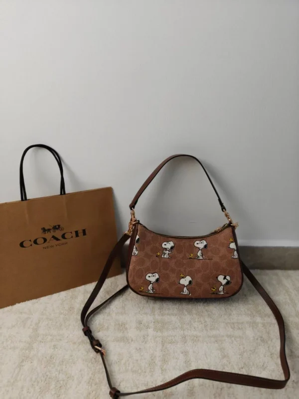 COACH x Peanuts Teri Shoulder Bag CBJ88 in Tan Brown Signature Canvas with Snoopy Print COACH x Peanuts Teri Shoulder Bag CBJ88 in Tan Brown Signature Canvas with Snoopy Print