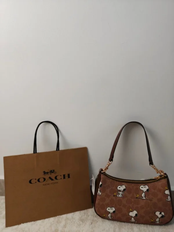 COACH x Peanuts Teri Shoulder Bag CBJ88 in Tan Brown Signature Canvas with Snoopy Print COACH x Peanuts Teri Shoulder Bag CBJ88 in Tan Brown Signature Canvas with Snoopy Print