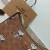 COACH x Peanuts Teri Shoulder Bag CBJ88 in Tan Brown Signature Canvas with Snoopy Print COACH x Peanuts Teri Shoulder Bag CBJ88 in Tan Brown Signature Canvas with Snoopy Print