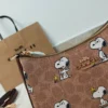 COACH x Peanuts Teri Shoulder Bag CBJ88 in Tan Brown Signature Canvas with Snoopy Print COACH x Peanuts Teri Shoulder Bag CBJ88 in Tan Brown Signature Canvas with Snoopy Print
