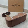 COACH x Peanuts Teri Shoulder Bag CBJ88 in Tan Brown Signature Canvas with Snoopy Print COACH x Peanuts Teri Shoulder Bag CBJ88 in Tan Brown Signature Canvas with Snoopy Print