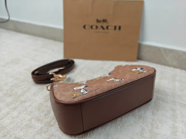 COACH x Peanuts Teri Shoulder Bag CBJ88 in Tan Brown Signature Canvas with Snoopy Print COACH x Peanuts Teri Shoulder Bag CBJ88 in Tan Brown Signature Canvas with Snoopy Print