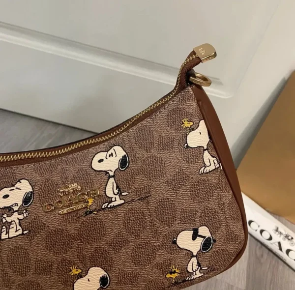 COACH x Peanuts Teri Shoulder Bag CBJ88 in Tan Brown Signature Canvas with Snoopy Print COACH x Peanuts Teri Shoulder Bag CBJ88 in Tan Brown Signature Canvas with Snoopy Print