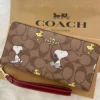 COACH x Peanuts CE705 Long Zip Around Wallet in Khaki Signature Canvas with Snoopy and Woodstock